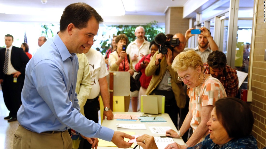 Walker prepares to cast his ballot at Jefferson School to vote in the gubernatorial recall election June 5, 2012, in Wauwatosa, Wisconsin.