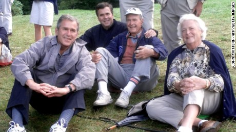 The Bush family, (left to right) former U.S. President George W., former Florida Governor Jeb, former U.S. President George and his wife Barbara, watch play during the Foursomes matches September 25, 1999 at The Country Club in Brookline, Massachusetts the site of the 33rd Ryder Cup Matches. 