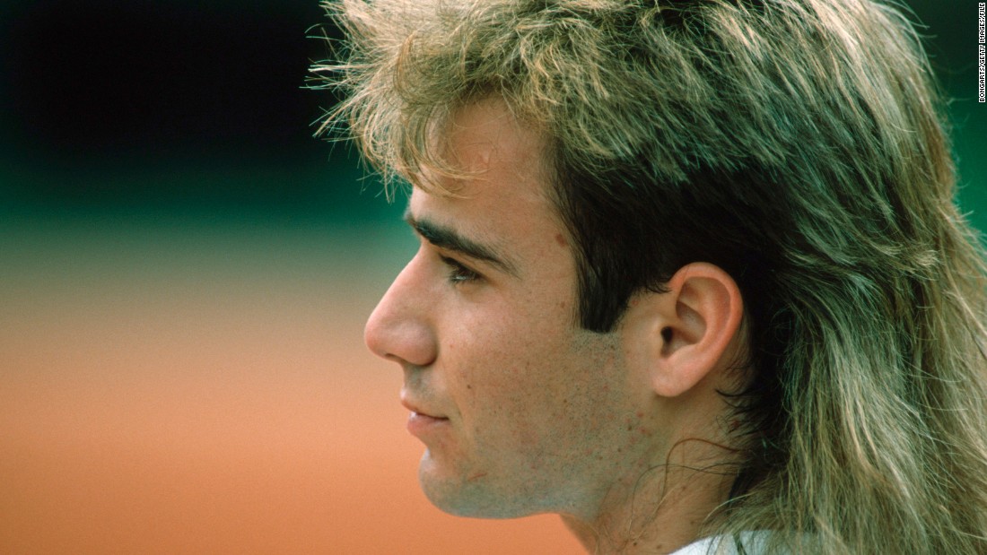 Pictured here in 1998 tennis legend Andre Agassi rocked long hair for many years. In his autobiography &quot;Open&quot; the star wrote that his long hairdo during the 1990s was actually a wig.