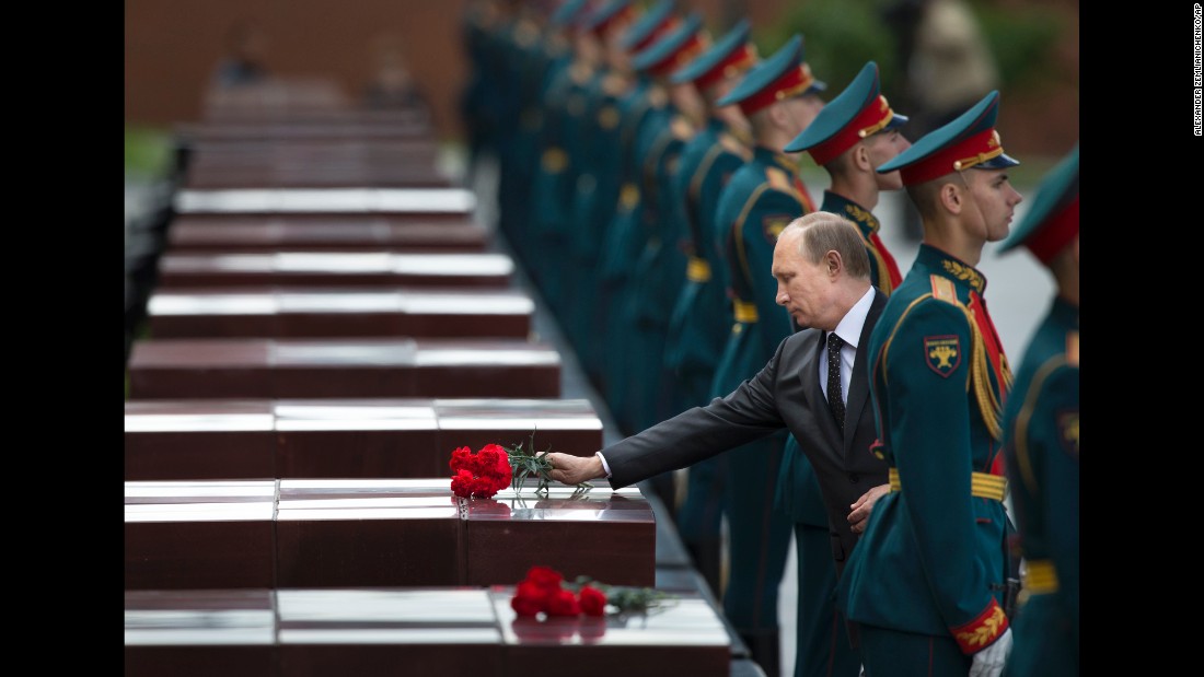 Putin takes part in a wreath-laying ceremony at the Tomb of the Unknown Soldier outside Moscow&#39;s Kremlin Wall in June.