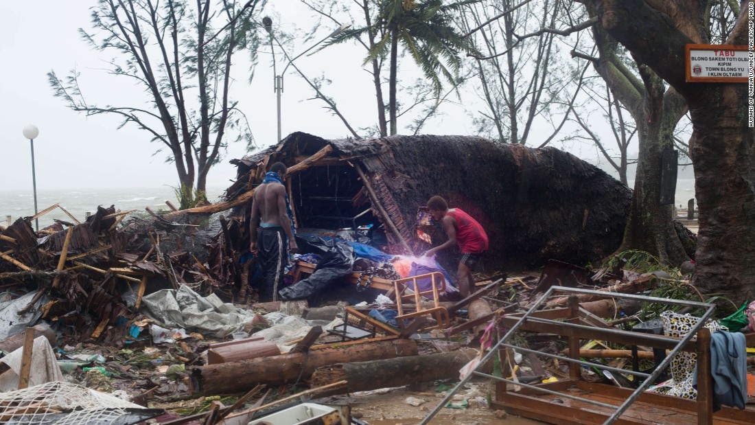 Residents look through storm damage in Port Villa on March 14. 