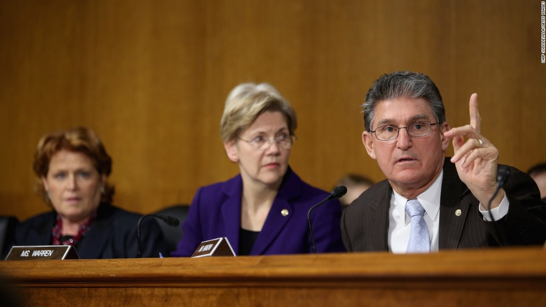 Senate Banking, Housing and Urban Affairs Committee members (right to left) Sen. Joe Manchin, Warren and Heidi Heitkamp participate in a hearing with then-Federal Reserve Bank Chairman, Ben Bernanke, after the release of The Semiannual Monetary Policy Report to the Congress on February 26, 2013, in Washington, D.C. 