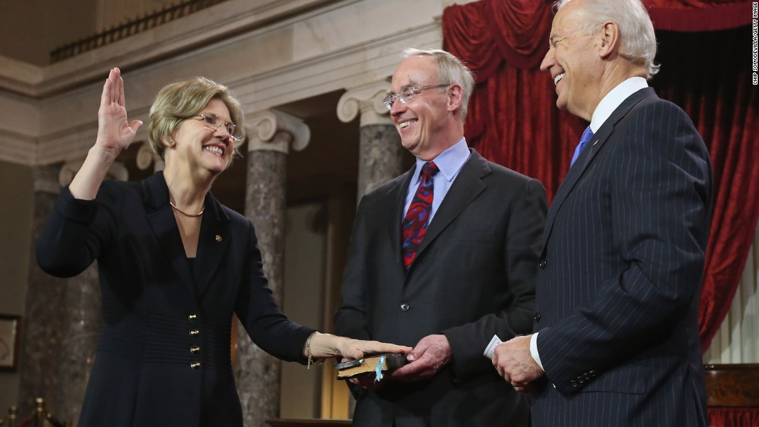 Warren participates in a ceremonial swearing-in with her husband Bruce Mann and Vice President Joe Biden in the Old Senate Chamber on January 3, 2013, in Washington, D.C. 