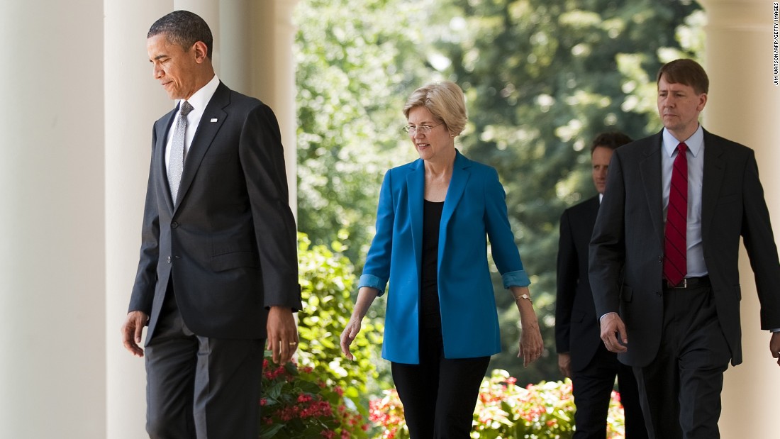 President Obama (left) and former financial adviser Elizabeth Warren (left) arrive at the nomination of former Ohio Attorney General Richard Cordray (right) to lead a consumer protection bureau at the White House on July 18, 2011.