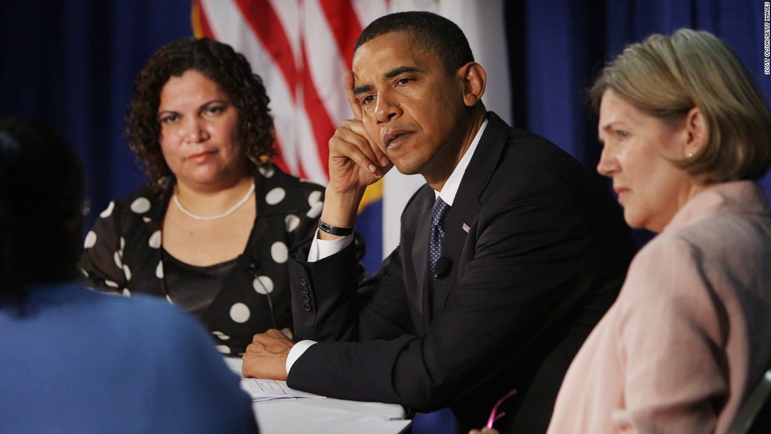 Then-Democratic presidential candidate Barack Obama (center) listens to questions with Rosa Figueroa (left) and Warren while hosting an economic round table at the Illinois Institute of Technology on June 11, 2008, in Chicago.