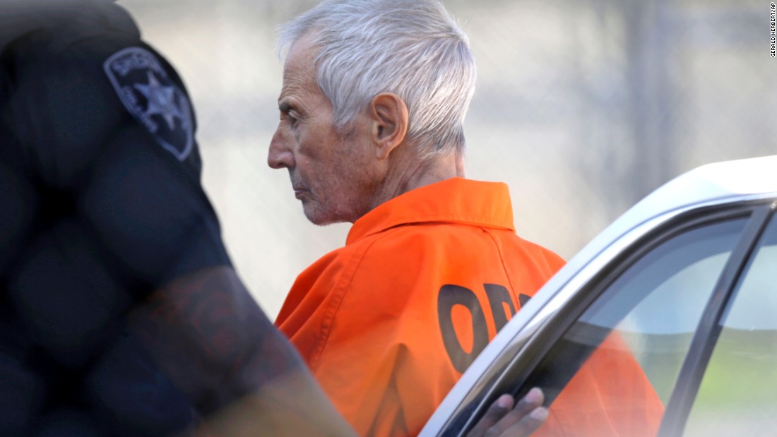 Robert Durst, a wealthy New York real-estate heir, is escorted into Orleans Parish Prison after his arraignment in New Orleans on Tuesday, March 17. Durst faces felony firearm and drug charges in New Orleans, and he has been charged with first-degree murder in Los Angeles. Investigators say they believe Durst, 71, was behind the slaying of Susan Berman, Durst&#39;s longtime friend. Durst is also the focus of the HBO documentary series &quot;The Jinx,&quot; which explores his wife&#39;s 1982 disappearance and investigators&#39; suspicions that Berman was killed because she knew what happened to her. Durst has long maintained he didn&#39;t kill Berman or have anything to do with his wife&#39;s disappearance.