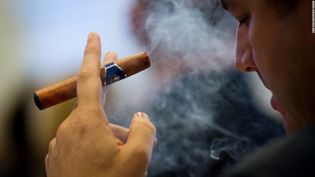 A delegate at the &quot;E-Cigarette Summit&quot; smokes an e-cigar. In the e-liquid, nicotine is usually suspended in propylene glycol and glycerine.