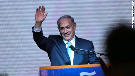 Israeli Prime Minister Benjamin Netanyahu greets supporters at the party&#39;s election headquarters In Tel Aviv. Wednesday, March 18, 2015.