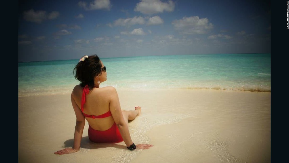 &lt;a href=&quot;http://ireport.cnn.com/docs/DOC-1222529&quot;&gt;iReporter Adam Fredeus&lt;/a&gt; snapped this photo of his girlfriend during a day-trip to a sandbank near Hanimaadhoo in the Maldives. Fredeus, who lives in Antwerp, Belgium, said that by staying in smaller, less expensive local resorts, they were able to experience the Maldives &quot;in a natural way with knowing the locals and understanding their culture.&quot; The Republic of Maldives is an independent island nation of nearly 1,200 islands and sandbanks in the Indian Ocean.