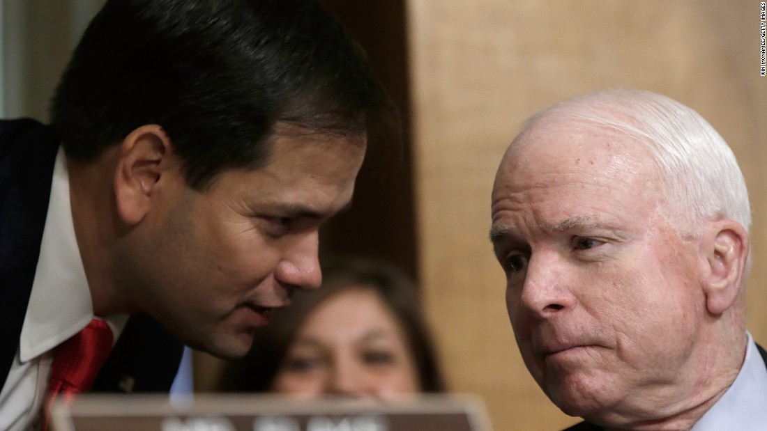 Rubio confers with McCain as U.S. Ambassador to Syria Robert Ford testifies before the Senate Foreign Relations Committee in October 2013.