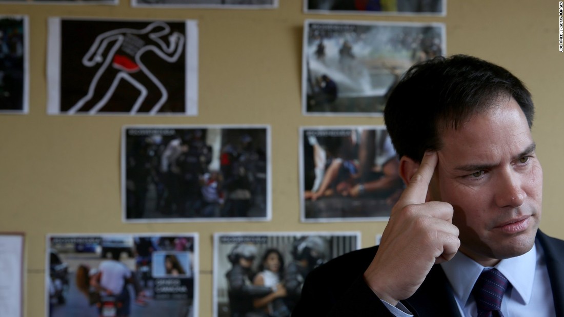 Rubio speaks to the media in front of a wall dedicated to the victims of the violence in Venezuela as he shows support for the Venezuelan community at a restaurant in Doral, Florida, in April 2014.