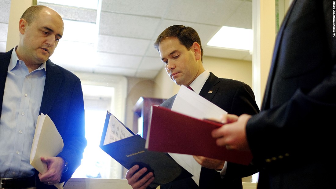 Rubio talks to aides in December before speaking on President Barack Obama&#39;s announcement about revising policies on U.S.-Cuba relations.