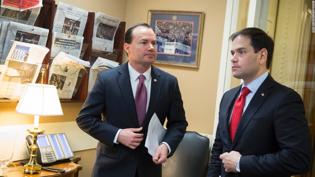 Sen. Mike Lee, left, and Rubio talk before a news conference to introduce their proposal for an overhaul of the tax code in March.