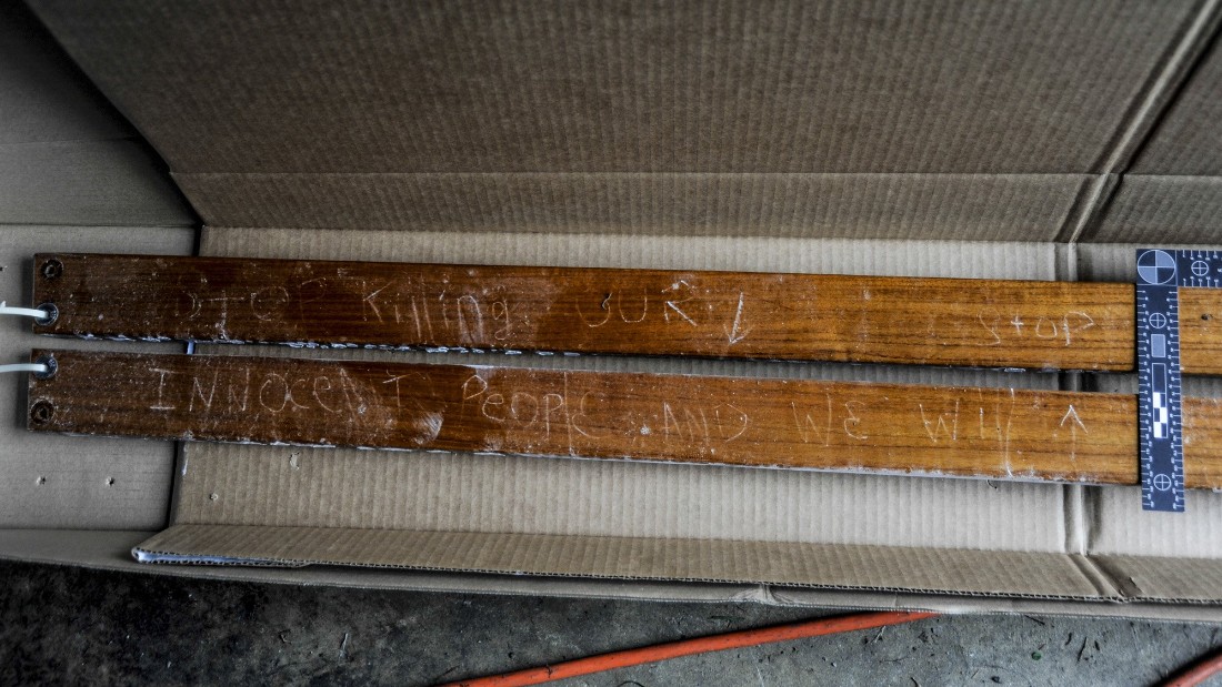 Prosecutors said these boards were attached to the boat where police found Dzhokhar Tsarnaev hiding. A carved message reads, &quot;Stop killing our innocent people and we will stop.&quot;