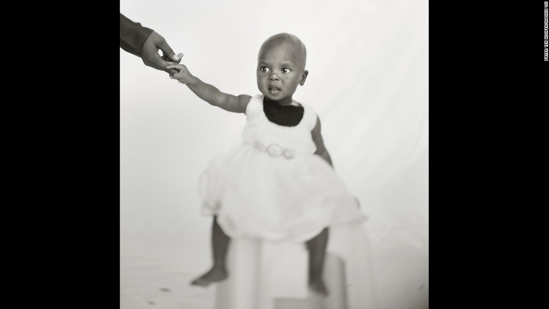 A 10-month-old girl named Buseiwa was one of the many refugees that Pieter ten Hoopen took portraits of in Sudan&#39;s capital of Khartoum. Just before she entered the studio, she had taken a blood test for malaria.