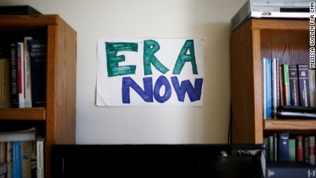 The offices of the Feminist Majority Foundation pay homage to an ongoing battle to secure equal rights for women. Amid framed posters gathered over the years are handmade signs like this one. 