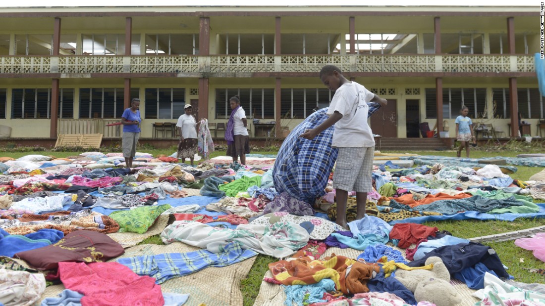 People put clothes out to dry near Port Vila on March 19.