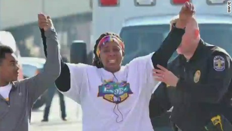 2015: Police officer Aubrey Gregory helps woman finish 10K race