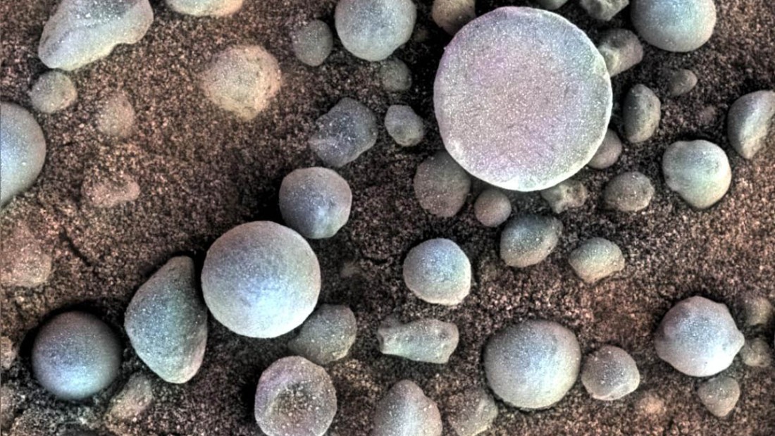 Are those Martian blueberries? These tiny spherules pepper the sandy surface in this 3-centimeter (1.2-inch) square view of the Martian surface. Opportunity took this image while the target was shadowed by the rover&#39;s instrument arm.