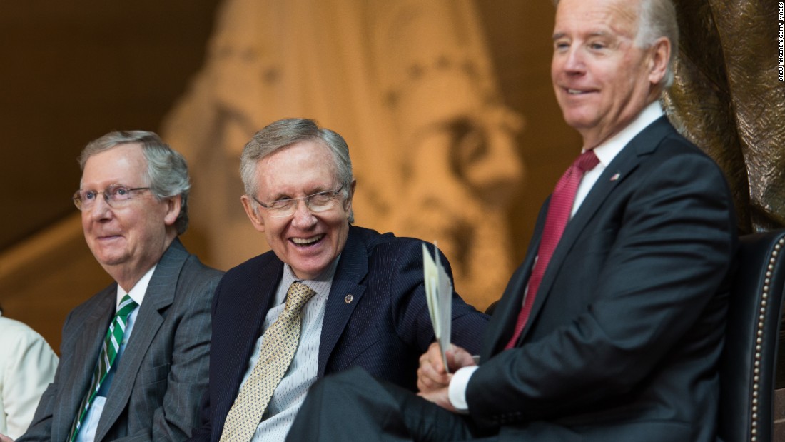 Reid, center, shares a laugh with Senate Minority Leader Mitch McConnell, left, and Vice President Joe Biden in 2013. They were attending the dedication ceremony for a new Frederick Douglass statue at the Capitol Visitor Center.