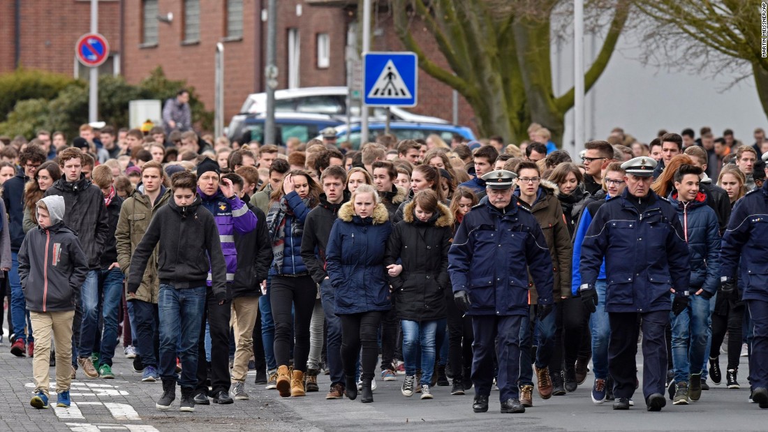 Students of the Joseph-Koenig Gymnasium school arrive for a memorial service in Haltern, Germany, on Friday, March 27. Sixteen students and two teachers from Haltern were among the victims.