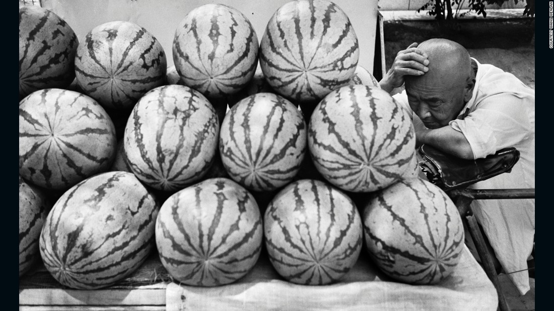 A watermelon vendor takes a nap in Beijing, 1995. Wang says he likes to capture life&#39;s more mundane moments.