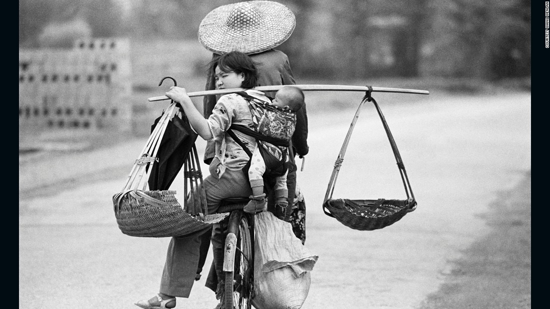 A family travels by bike in Guangxi, 1988. The bicycle once was a family&#39;s most precious asset.