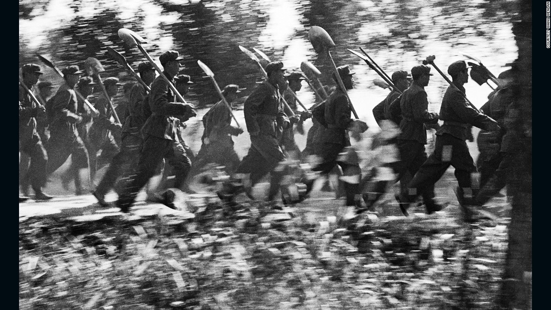 Men with shovels run to the rescue in the aftermath of the massive Tangshan earthquake in 1976. The photo was published a decade later.