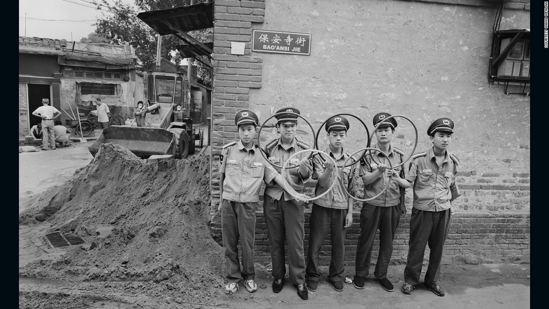 Security guards in Beijing hold five rings to make the Olympic symbol. Beijing hosted the Summer Olympics in 2008. 