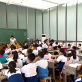 Pupils siiting in an open glasses classroom in China