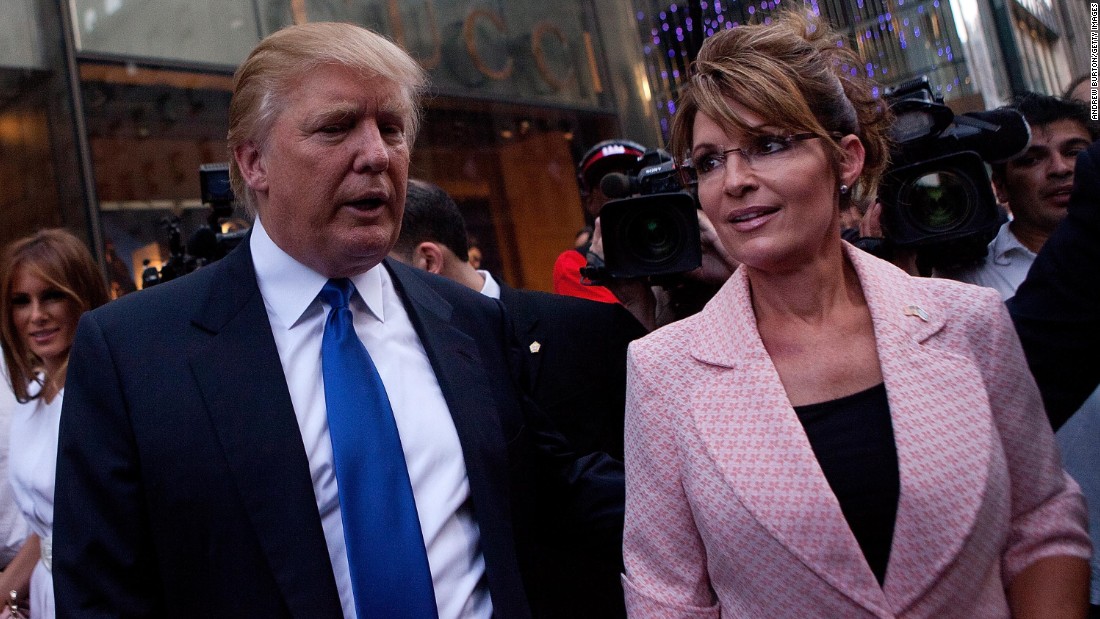 Former U.S. vice presidential candidate and Alaska Gov. Sarah Palin and Trump walk toward a limousine after leaving Trump Tower, at 56th Street and Fifth Avenue, on May 31, 2011, in New York City. 