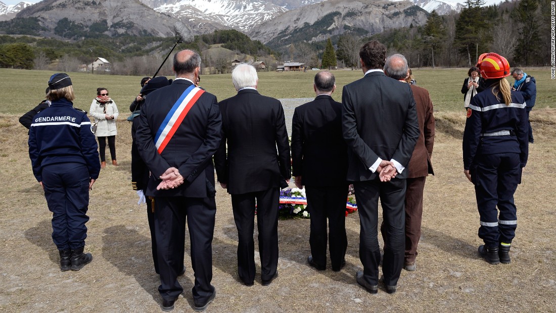 French government officials observe a moment of silence for &lt;a href=&quot;http://www.cnn.com/2015/03/24/world/gallery/france-plane-crash/index.html&quot; target=&quot;_blank&quot;&gt;Germanwings Flight 9525&lt;/a&gt; near the crash site Friday, April 3, in Le Vernet, France. 