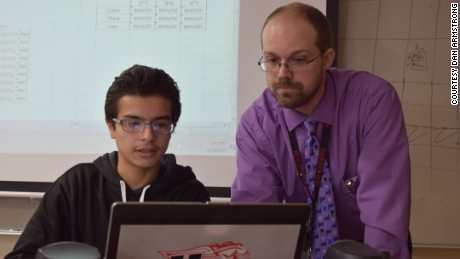 Huntley High School student Johnathan Sanabria and biology teacher Ryan Marsh model how organisms evolve over time. The school&#39;s blended learning program combines online and in-person education.
