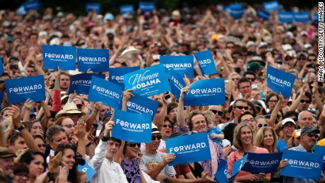 Supporters wave &quot;Forward&quot; signs as President Barack Obama speaks at a rally on September 2, 2012, in Boulder, Colorado.