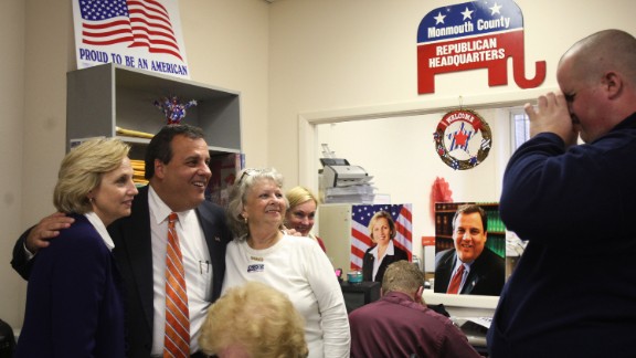 Christie and his running mate, Kim Guadagno, left, pose for photographs after making phone calls to voters at Monmouth County Republican Headquarters in Freehold, New Jersey, on November 2, 2009.