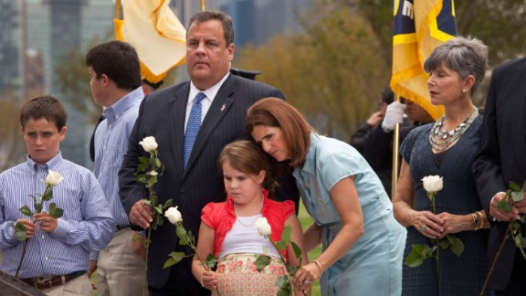 Christie and his family lay white roses on wreckage pulled from Ground Zero during the dedication of the Empty Sky Memorial for 9/11 at Liberty State Park in Jersey City, New Jersey, on September 10, 2011.