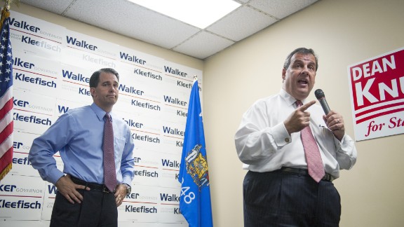 Christie campaigns for Wisconsin Gov. Scott Walker during a campaign stop at the GOP field office in Hudson, Wisconsin, on September 29, 2014.