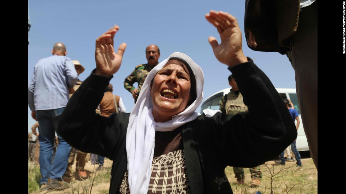 A Yazidi woman mourns for the death of her husband and children by ISIS after being released south of Kirkuk on April 8. ISIS is known for killing dozens of people at a time and carrying out public executions, crucifixions and other acts. 