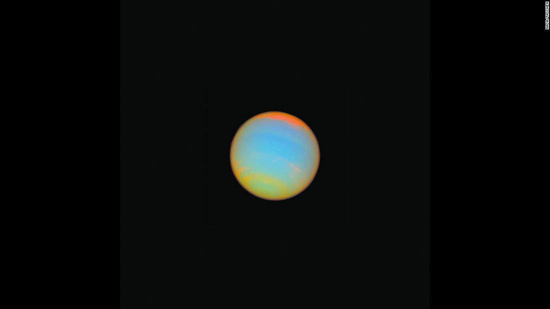 Hubble captured this image of the distant blue-green world Neptune in 2005. Fourteen different colored filters were used to help scientists learn more about Neptune&#39;s atmosphere. Neptune is about 2.8 billion miles from Earth.