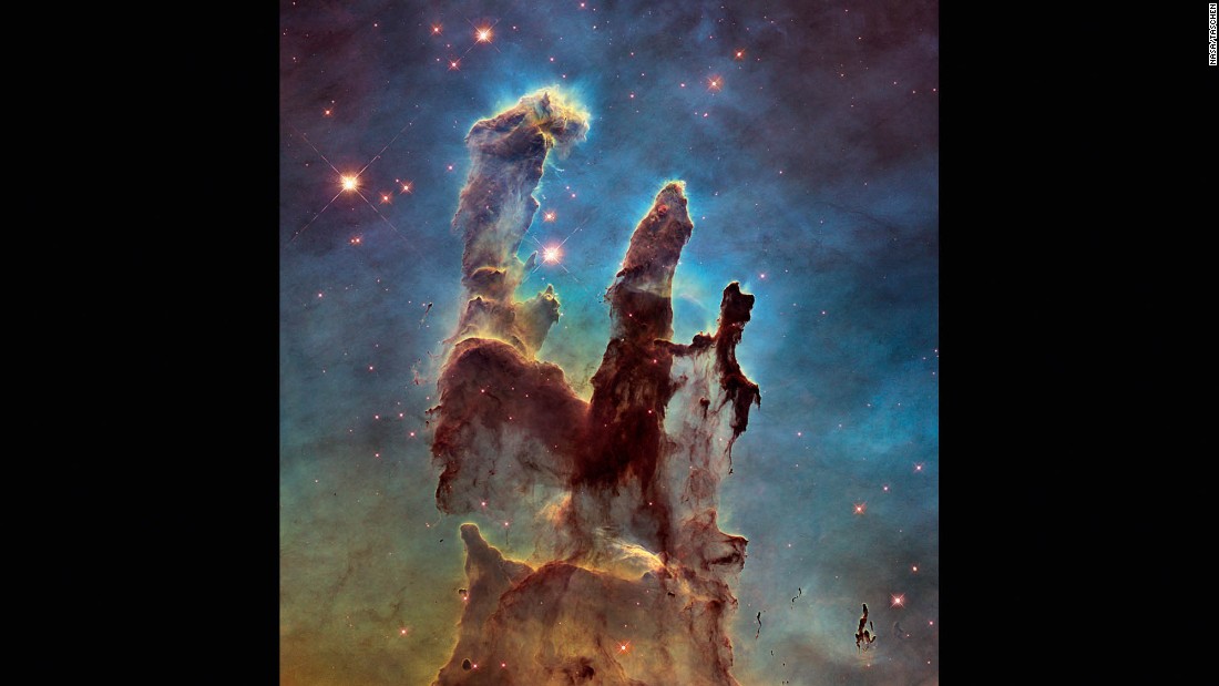 Astronomers combined several Hubble images taken in 2014 to create an upgraded view of the Hubble&#39;s iconic 1995 &quot;Pillars of Creation&quot; image. The new image shows a wider view of the pillars, which stretch about 5 light-years high. The pillars are part of a small region of the Eagle Nebula, which is about 6,500 light years from Earth.