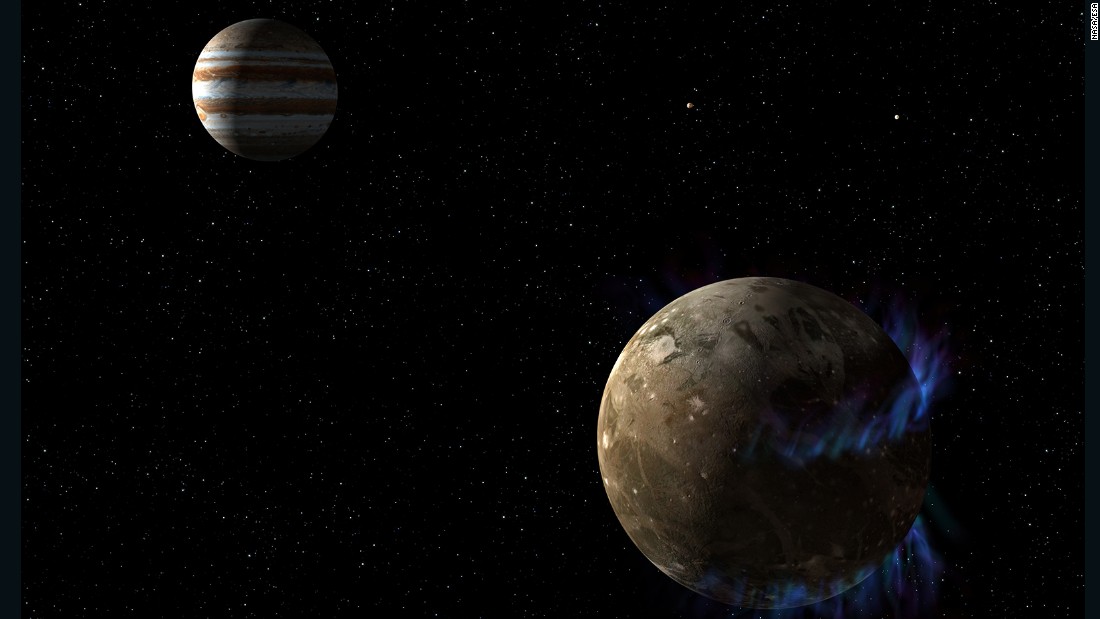 In this artist&#39;s concept, the moon Ganymede, right, orbits the giant planet Jupiter. NASA&#39;s Hubble Space Telescope observed auroras on the moon generated by Ganymede&#39;s magnetic fields. A saline ocean under the moon&#39;s icy crust best explains shifting in the auroral belts measured by Hubble.