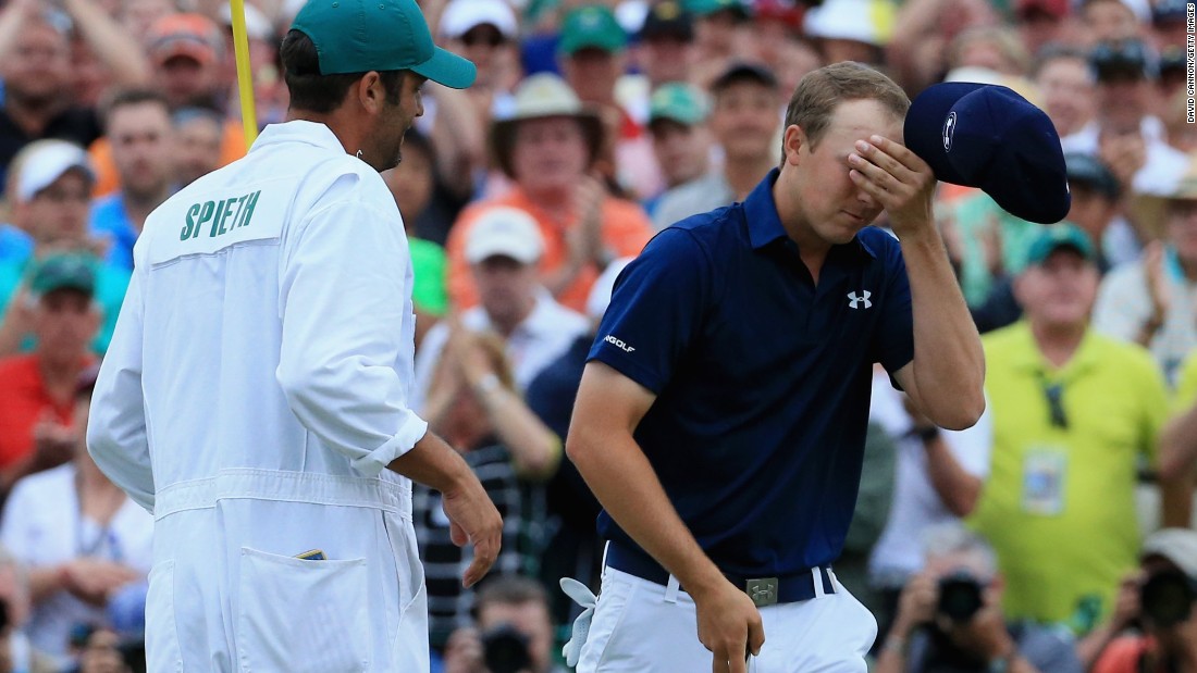 Masters champion Jordan Spieth savors the moment with his caddy Michael Greller after clinching his first major title by four strokes from Phil Mickelson and Justin Rose. &lt;a href=&quot;http://www.pga.com/masters/scoring/leaderboard&quot; target=&quot;_blank&quot;&gt;(See leaderboard)&lt;/a&gt;