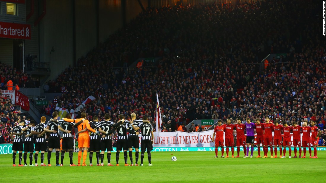 Fans, players and officials mark the Hillsborough anniversary before the Premier League match between Liverpool and Newcastle at Anfield in 2015.