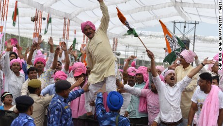 Indian Congress Party supporters shout slogans during a rally against a new land bill in Delhi on April 19, 2015.