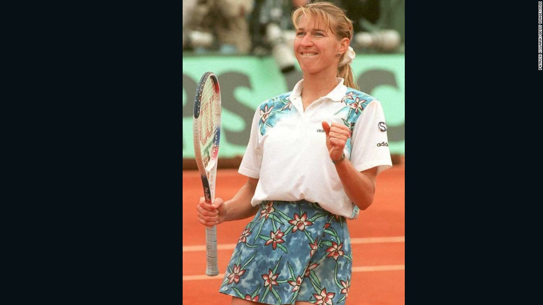 Germany&#39;s Steffi Graf wears a floral skirt during the French Open in 1995. Note the scrunchie.  
