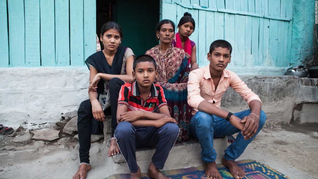 Manda Shastrakar sits with her family on the steps of her home in Vidarbha. Her husband committed suicide on January 14 this year.  He doused himself with kerosene and set himself alight. He died near the steps where the family now sits. His family says he was was under pressure to repay hefty debts.