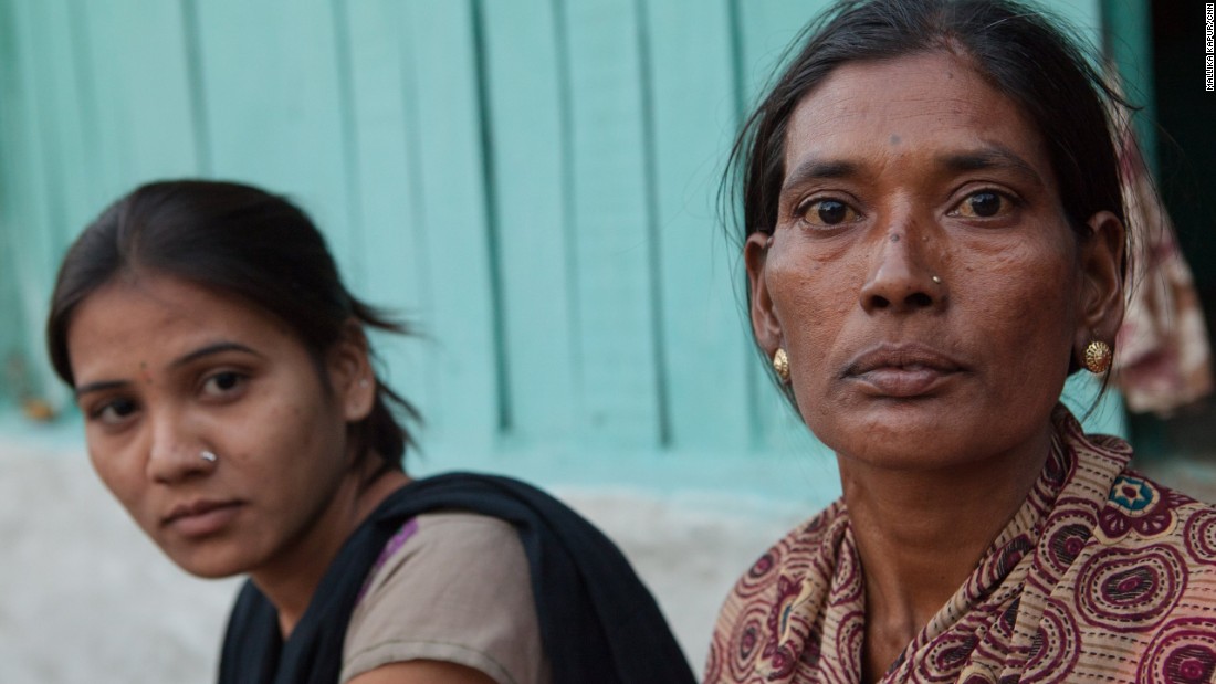 Manda Shastrakar with her oldest daughter. She has to feed her family and keep paying for them to go to school. All the children must now work in the cotton fields to help make ends meet. Manda will also face a heavy expense in years to come -- getting all her children married and paying for their weddings.