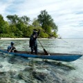 pacific island fisherman paddle out