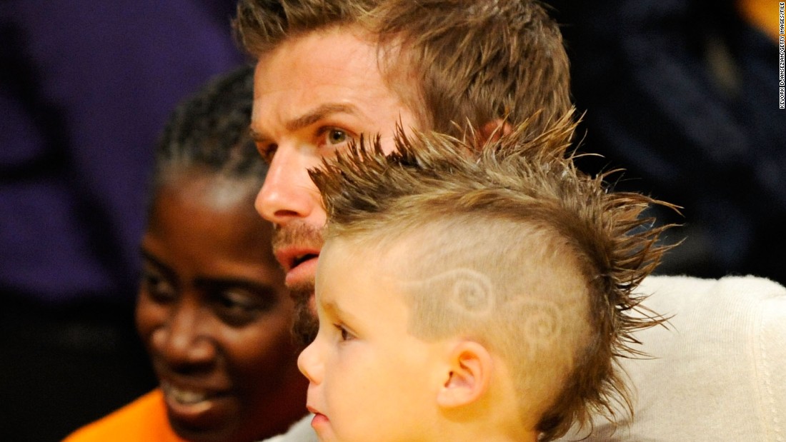 Like father, like son: the Beckhams&#39; third offspring Cruz with his dad at an NBA game in LA in 2009.