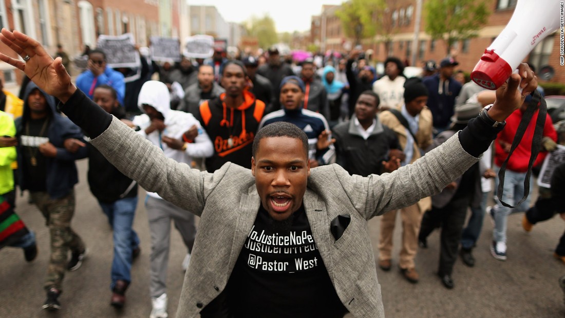 Hundreds of demonstrators march toward the Western District station on April 22.